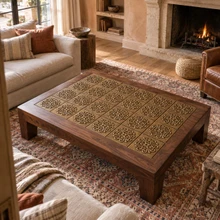 Loop Cross Knot Celtic knot tiles in hand-embossed brass, inlaid in the top of a wooden coffee table in a living room