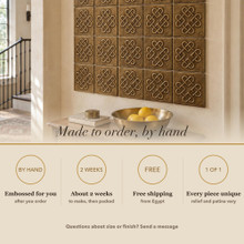 Card noting that the Four Heart Knot tiles are made to order by hand