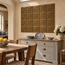 Star Cross Knot Celtic knot tiles in hand-embossed brass, as a wall panel above a painted sideboard in a dining room