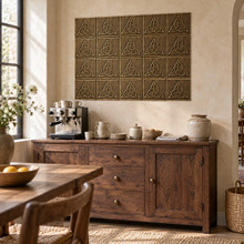 Interlaced Trinity Knot in hand-embossed brass, as a wall panel above a coffee station sideboard in a dining room