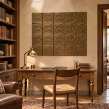 Woven Star Knot Celtic knot tiles in hand-embossed brass, as a wall panel above a wooden writing desk in a study