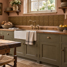 Framed Square Knot in hand-embossed brass, as a backsplash band behind a farmhouse sink in a country kitchen