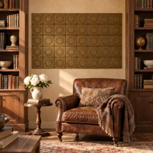 Hexagon Ring Knot in hand-embossed brass, as a wall panel between bookcases above a leather armchair in a library
