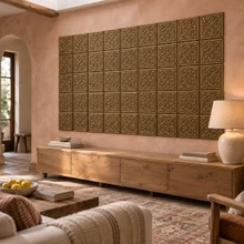 Lattice Loop Knot Celtic knot tiles in hand-embossed brass, as a large wall panel above a low media console in a living room