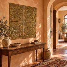 Hand-embossed solid brass fleur-de-lis tiles in aged bronze as a panel above a console table in an entrance hall