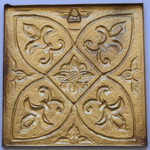 Back of the 8 inch brass tile showing the hollow back to fill with tile adhesive and the small hanger