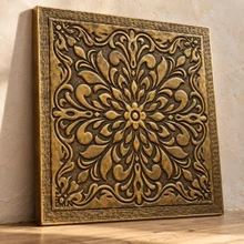 Mandala Medallion, hand-embossed brass wall panel in aged bronze: three-quarter view showing the 10 mm edge and raised rim