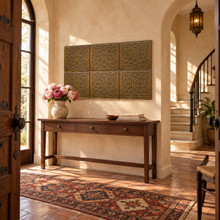 Star and Hexagon solid brass tiles in aged bronze, six hung above a wooden console table in an entrance hall