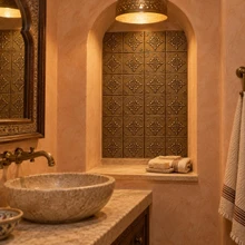 Hand-embossed solid brass Fleur Cross tiles in aged bronze: lining a bathroom niche