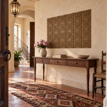 Swan Scroll, hand-embossed solid brass tiles in aged bronze: entrance hall feature wall above a console