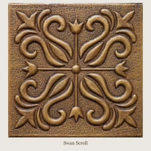 Swan Scroll: one hand-embossed solid brass tile in aged bronze, 6 mm deep with a raised rim, shown as it will be made