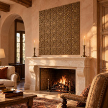 Swan Scroll, hand-embossed solid brass tiles in aged bronze: feature panel above a living room fireplace