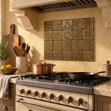 Celtic Knot Collection B, 20 hand-embossed brass 4 inch tiles: accent panel in a kitchen backsplash behind a range