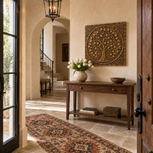 Curling Branch Tree of Life in a circle, one hand-embossed solid brass wall panel in aged bronze: hung in an entrance hall