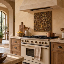 Open Branch Tree of Life in a circle, one hand-embossed brass wall panel: statement backsplash behind a kitchen range