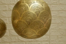 Moroccan lamps over kitchen island