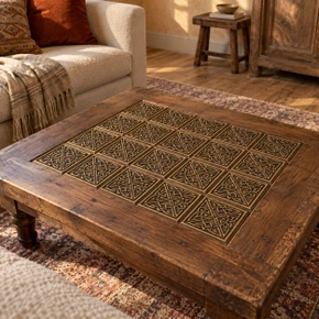Saltire Knot Celtic knot tiles in hand-embossed brass, inlaid in the top of a wooden coffee table in a living room
