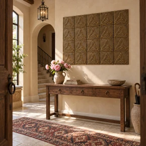 Braided Triangle Knot Celtic knot tiles in hand-embossed brass, as a wall panel above a console table in an entrance hall