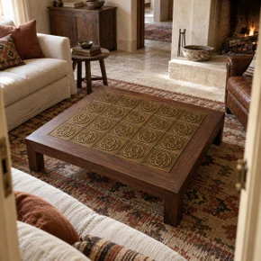 Trefoil Circle Knot Celtic knot tiles in hand-embossed brass, inlaid in the top of a wooden coffee table in a living room