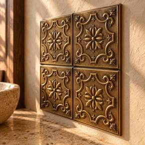 Cartouche, hand-embossed solid brass in aged bronze: close-up of the 6 mm tile edges and raised rims
