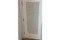 Mashrabiya interior door — solid wood grain and finish detail