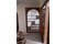 Arched wood room divider — solid wood grain and finish detail
