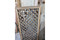 Diamond lattice room divider in hand-cut solid wood