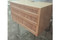 Carved arched cabinet — solid wood grain and finish detail
