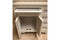 Mashrabiya bathroom vanity cabinet — decorative geometric woodwork detail