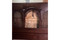 Mashrabiya bed frame and headboard — solid wood grain and finish detail