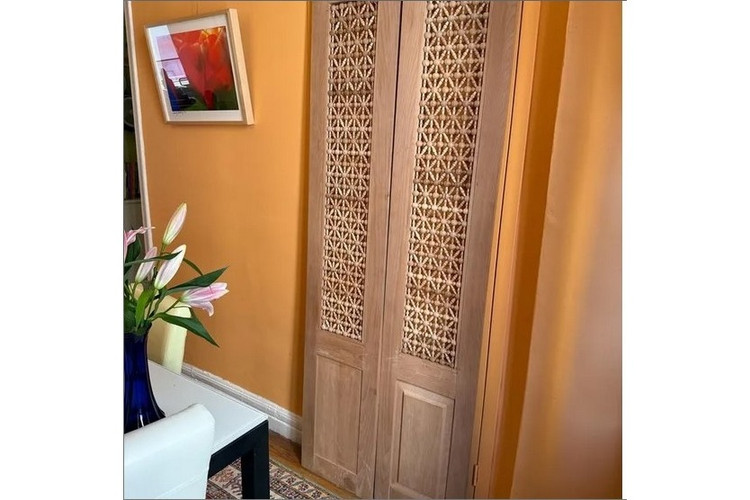 Mashrabiya interior door in hand-cut solid wood