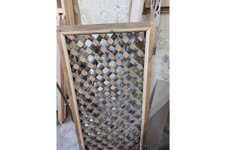 Diamond lattice room divider in hand-cut solid wood