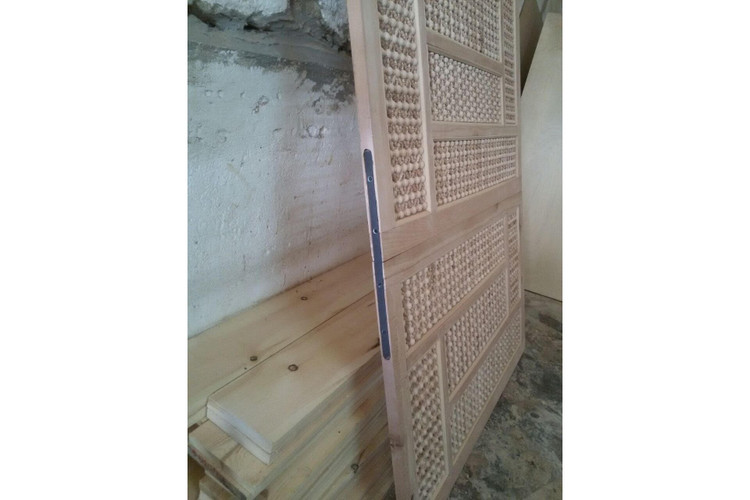 Carved mashrabiya screen in hand-cut solid wood