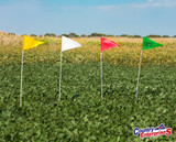 Vinyl field marker flags in a crop field.