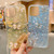 For iPhone 14 Pro Max Starry Sequin Jade Butterfly Epoxy TPU Phone Case with Strap(Blue)