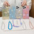 For iPhone 15 Plus Starry Sequin Jade Butterfly Epoxy TPU Phone Case with Strap(Silver)