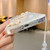 For iPhone 15 Plus Starry Sequin Jade Butterfly Epoxy TPU Phone Case with Strap(Silver)