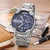 CAGARNY 6820 Fashionable Business Style Large Dial Dual Time Zone Quar0tz Movement Wrist Watch with Stainless Steel Band & Calendar Function for Men(Silver Band Blue Window)