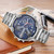 CAGARNY 6820 Fashionable Business Style Large Dial Dual Time Zone Quar0tz Movement Wrist Watch with Stainless Steel Band & Calendar Function for Men(Silver Band Blue Window)