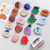 5pcs Cartoon Shape Airbag Ring Holder Epoxy Lazy Desktop Telescopic Phone Holder(Planet)