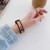 For Xiaomi Mi Band 6 / 5 Universal Two-color Silicone Replacement Wrist Band(Orange+Black)
