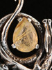 Curled Dragon Pendant with Rutilated Quartz