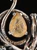 Curled Dragon Pendant with Rutilated Quartz - Sterling Silver