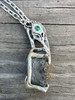Raven Skull with Ammonite Negative and Tsavorite Eyes - Silver
