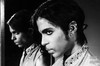 Prince wearing the Moon Ear Wrap. Photograph by Steve Parke titled Moon in the Mirror.