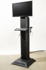 Rolling mobile workstation with integrated computer mount for on-floor monitoring, task organization, and improved job efficiency in industrial environments.