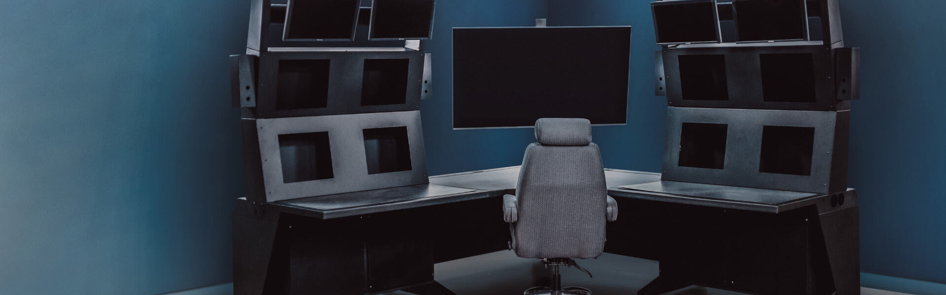 Command and Control center with multiple monitors and chairs