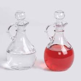 Cruet &  Stopper Set is 5 1/2" High. 6oz. Capacity. Sold as a Pair