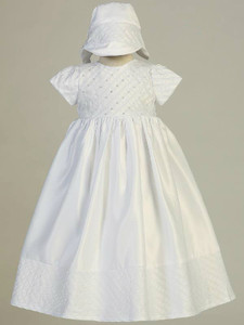 Embroidered white satin gown with sequins and beads. Comes with matching bonnet.   XS(3-6m), S(6-12m), M(9-12m), L(12-18m) & XL(18-24m).  Made in USA. 

 