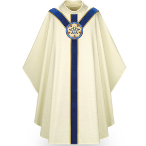 Marian Chasuble made of white Cantate, a fabric of 99% wool and 1% gold luxe threads. Stiff Roll Collar "4" neck finish, and is a Gothic Cut. St. Andrew's Cross orphrey in blue velvet with hand embroidered Ave Maria medallion on front and back. Comes with an Inside Stole.  Standard size is 53" length x 59" width. Shown here in white. Other collar choices, colors and matching ecclesiastical garments are available. 